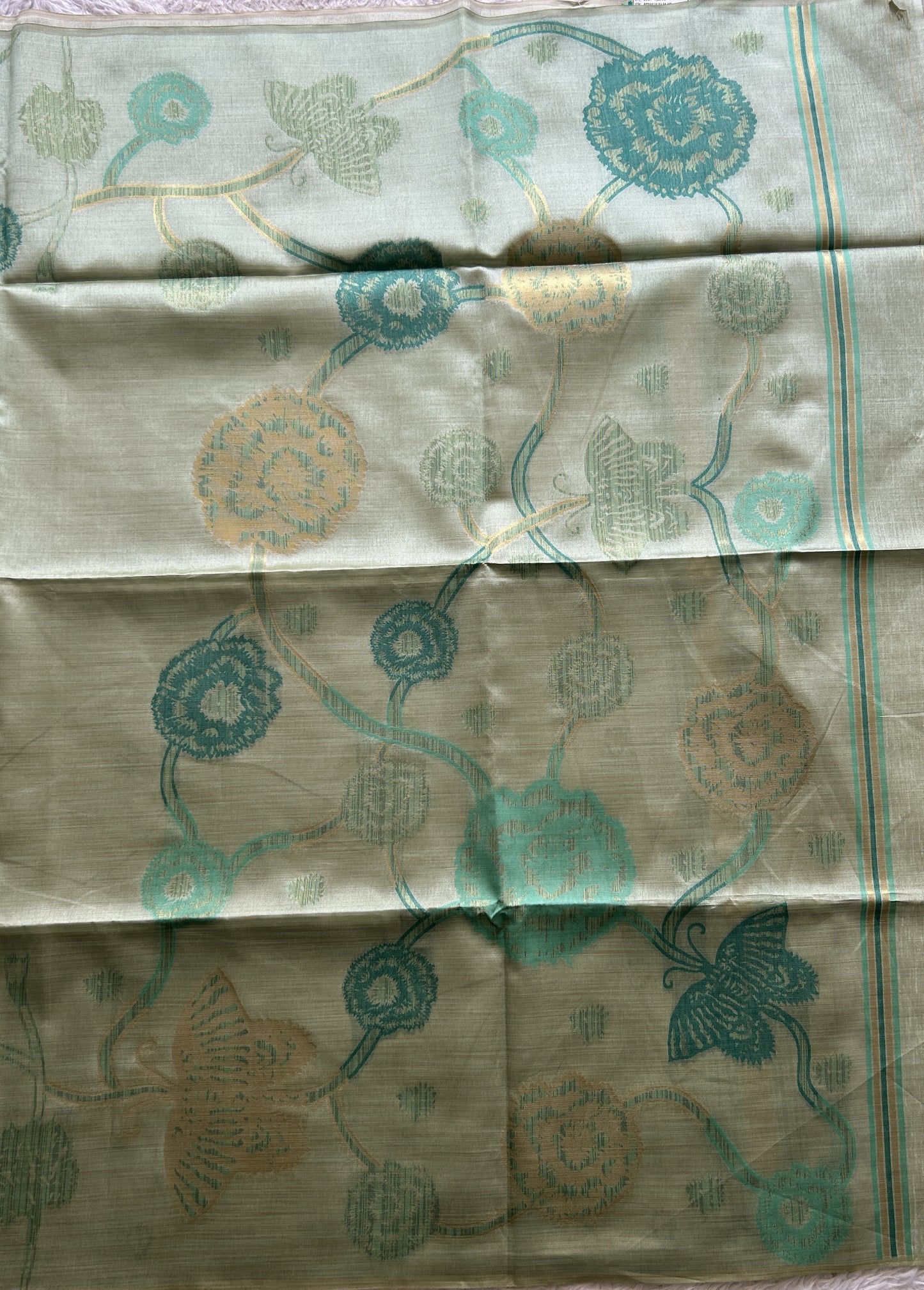 Semi Tussar Saree Fern Colored complemented with a Embosed Border. - Sampradaya Designer Studio