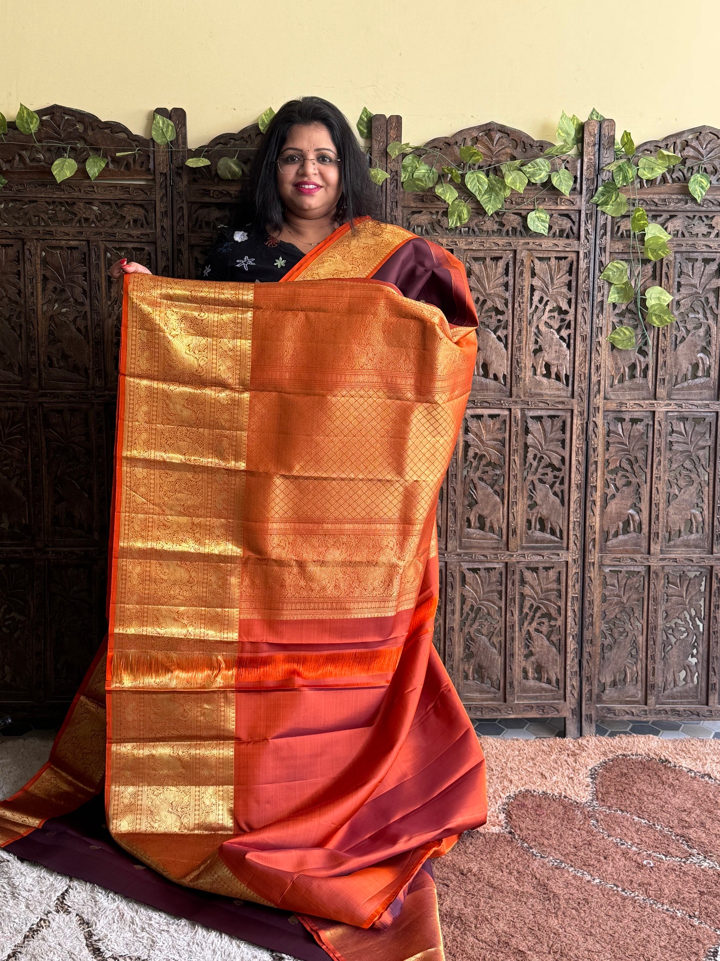 Pure Kanjivaram Silk Saree Chocolate brown Colored Elegantly Paid with a Gold Zari Border.