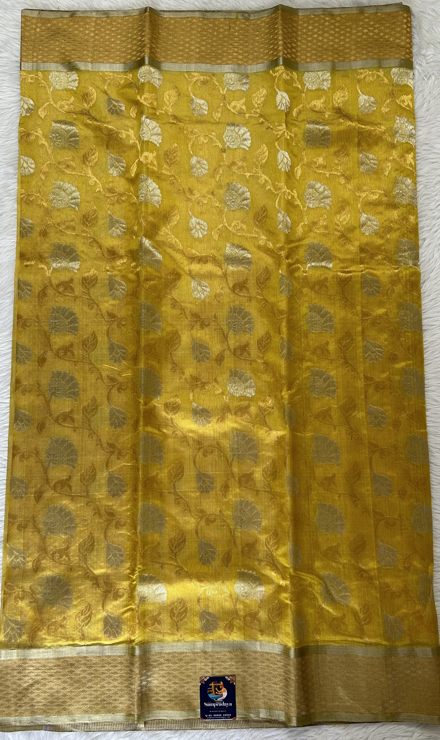 Chanderi Pattu Saree Yellow colored saree complemented with a Gold Zari border - Sampradaya Designer Studio