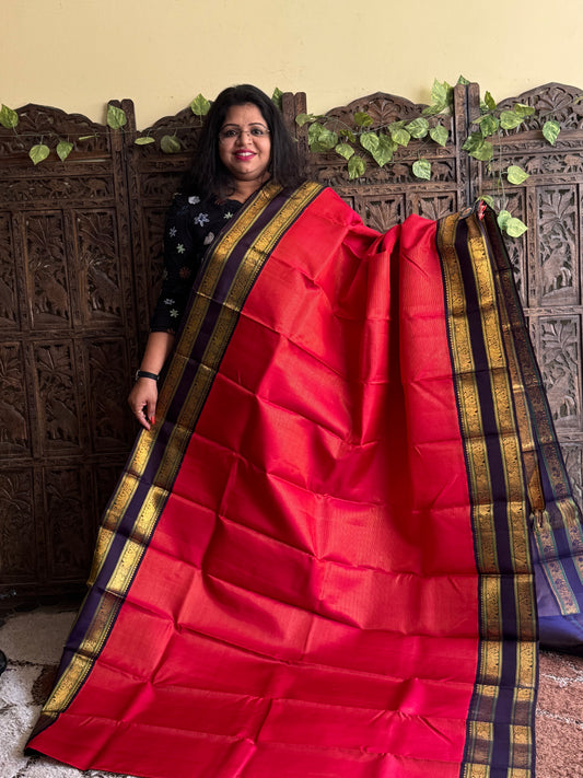 Pure Kanjivaram Silk Saree Dark Red Colored Elegantly Paid with a Gold Zari Border.