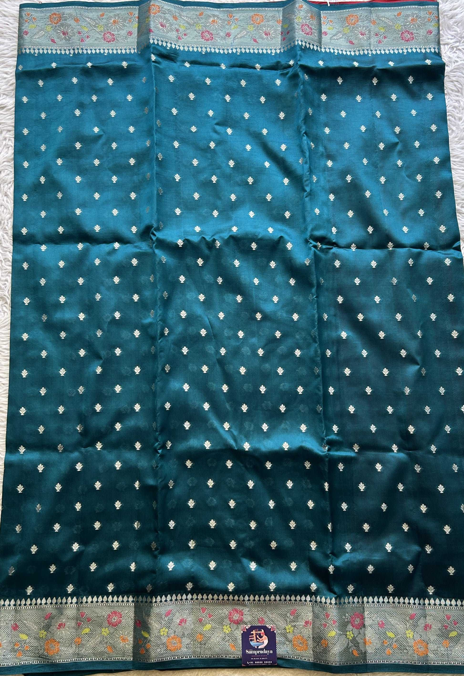 Chiniya Silk Saree Peacock Blue Colored Exquisite with a Zari Border. - Sampradaya Designer Studio