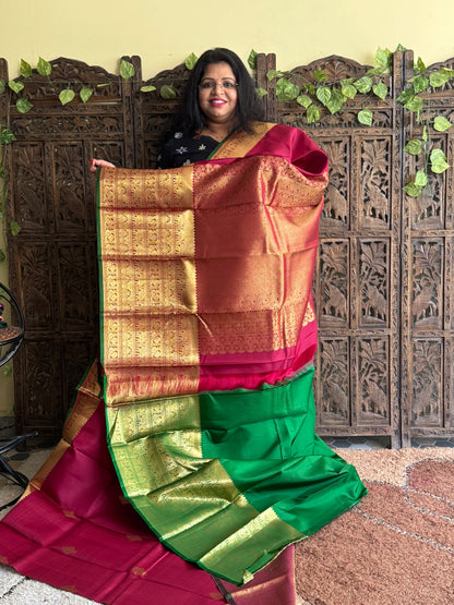 Pure Kanjivaram Silk Saree Wine Colored Elegantly Paid with a Gold Zari Border.