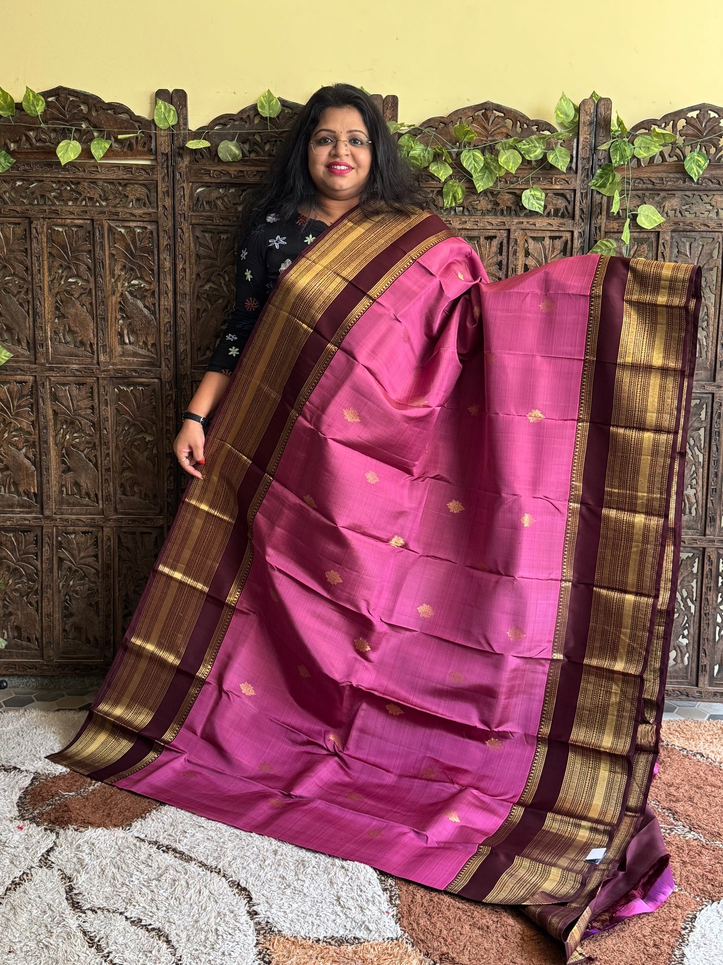 Pure Kanjivaram Silk Saree Lilac Colored Elegantly Paid with a Gold Zari Border.