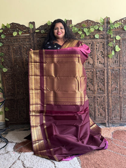 Pure Kanjivaram Silk Saree Lilac Colored Elegantly Paid with a Gold Zari Border.