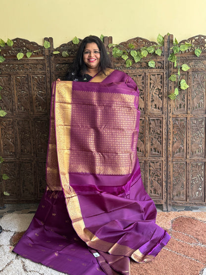 Pure Kanjivaram Silk Saree Purple Colored with Gold Zari Border.