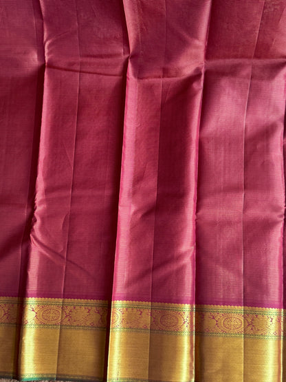 Pure Kanjivaram Silk Saree Dark Marron Colored Complemented with a Gold Zari Border.