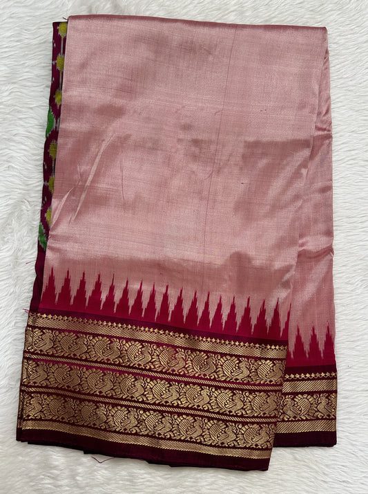 Ikkat Pattu Saree Onion Pink colored Saree complemented with a Magenta Colored Kanchi border. - Sampradaya Designer Studio