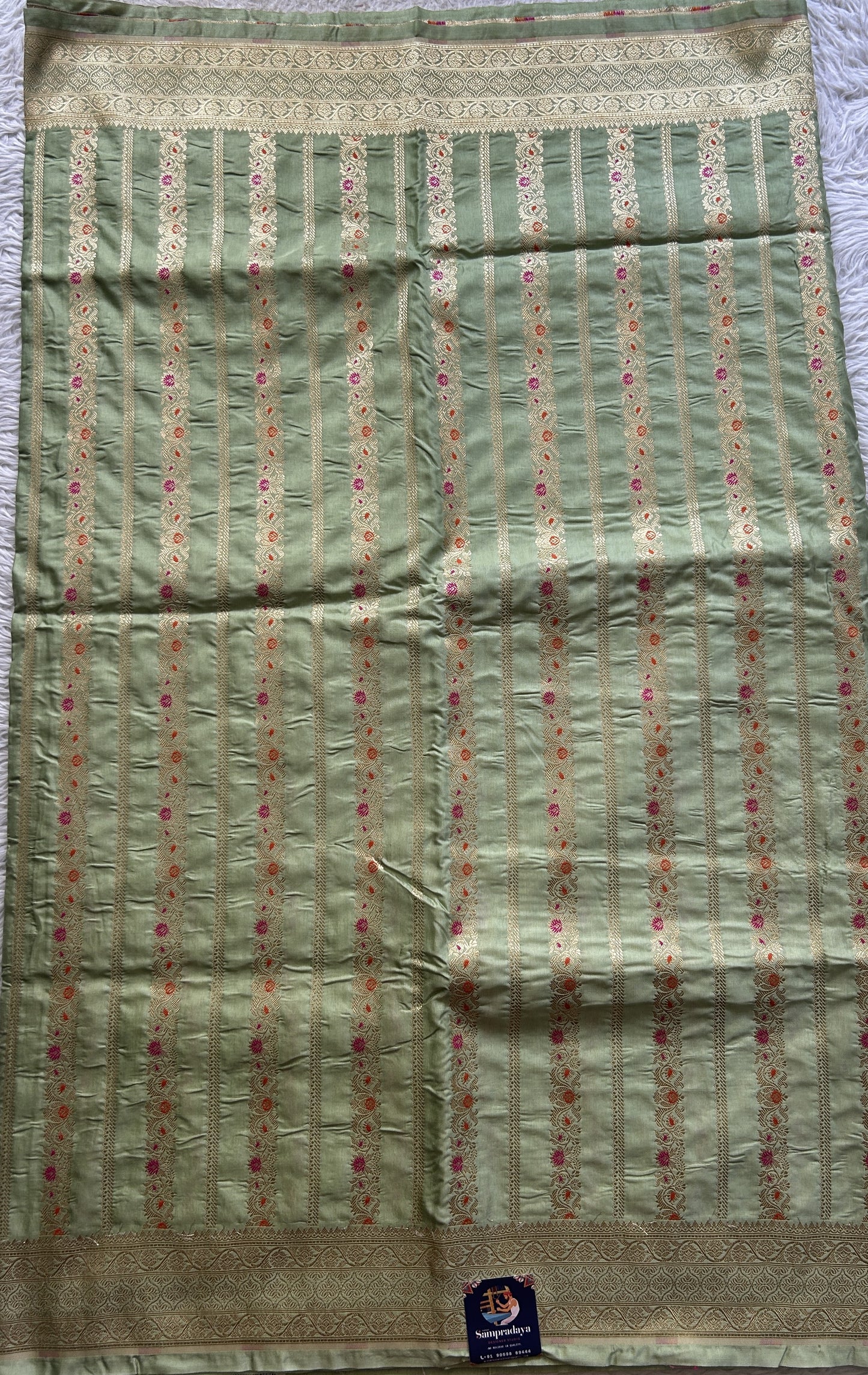 Chiniya Silk Saree Light Green Colored Elegantly Paired with a Zari Border. - Sampradaya Designer Studio