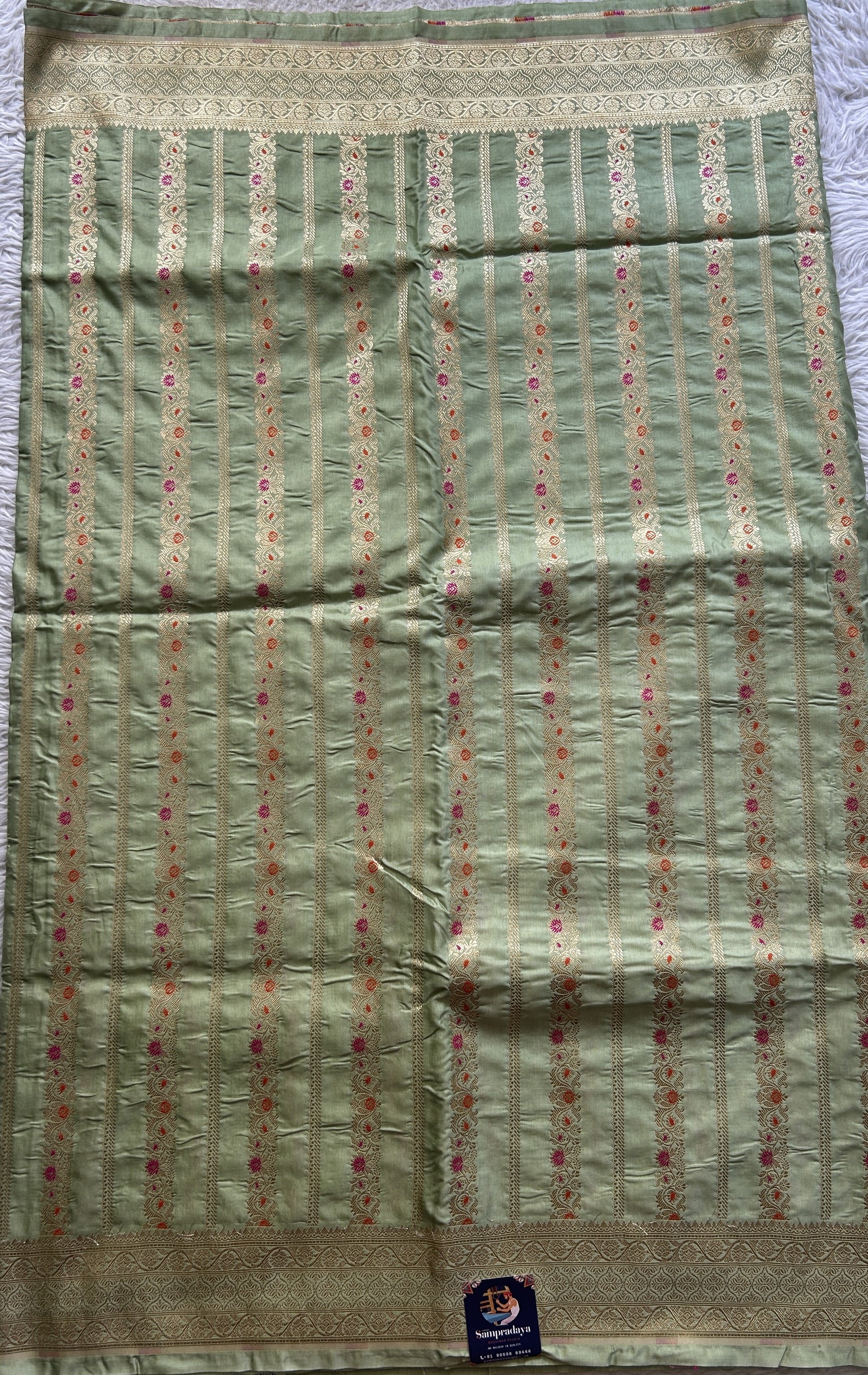 Chiniya Silk Saree Light Green Colored Elegantly Paired with a Zari Border. - Sampradaya Designer Studio