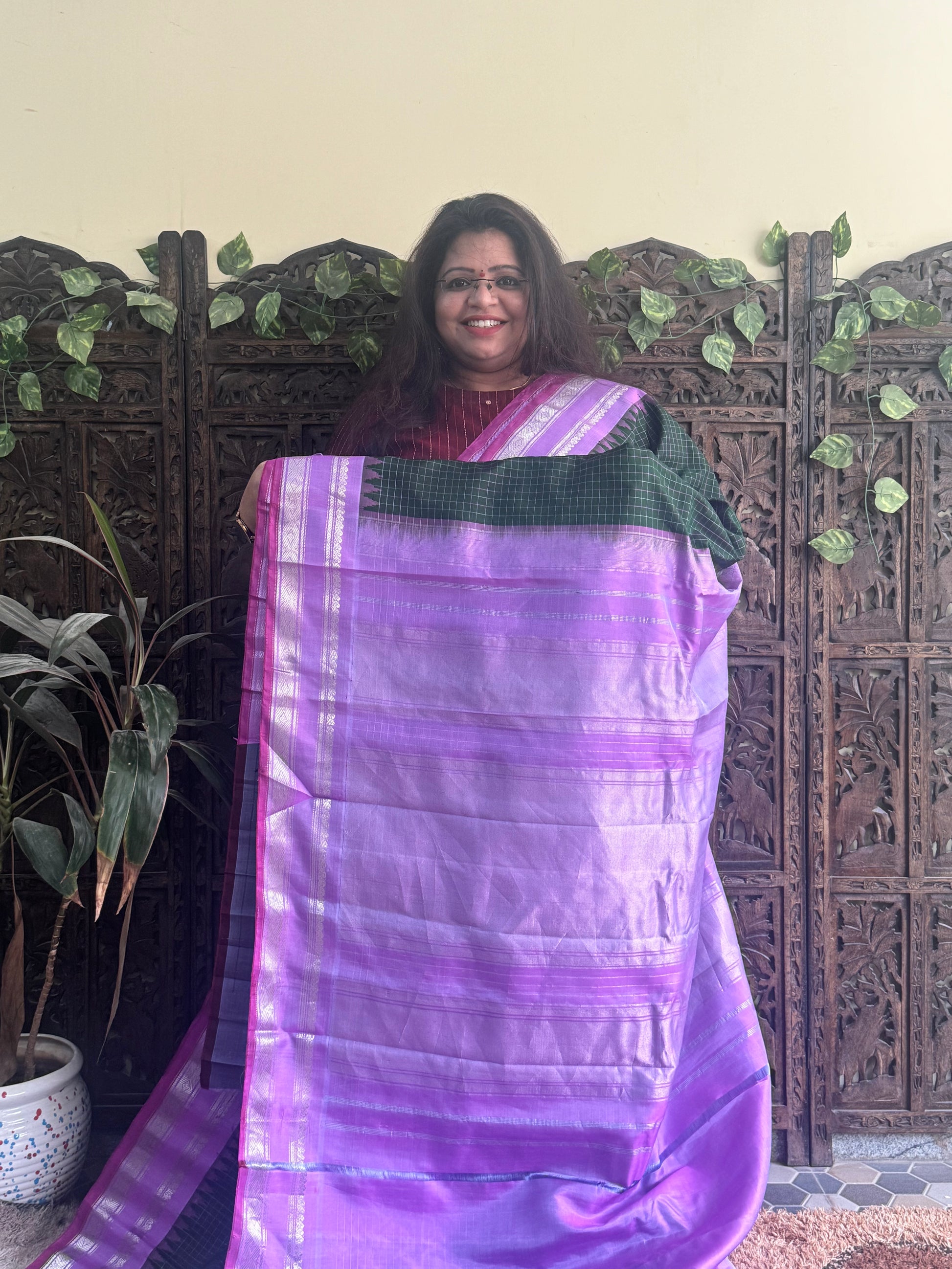 Gadwal Silk Saree Bottle Green Colored Complemented With a Lilac Zari Border - Sampradaya Designer Studio