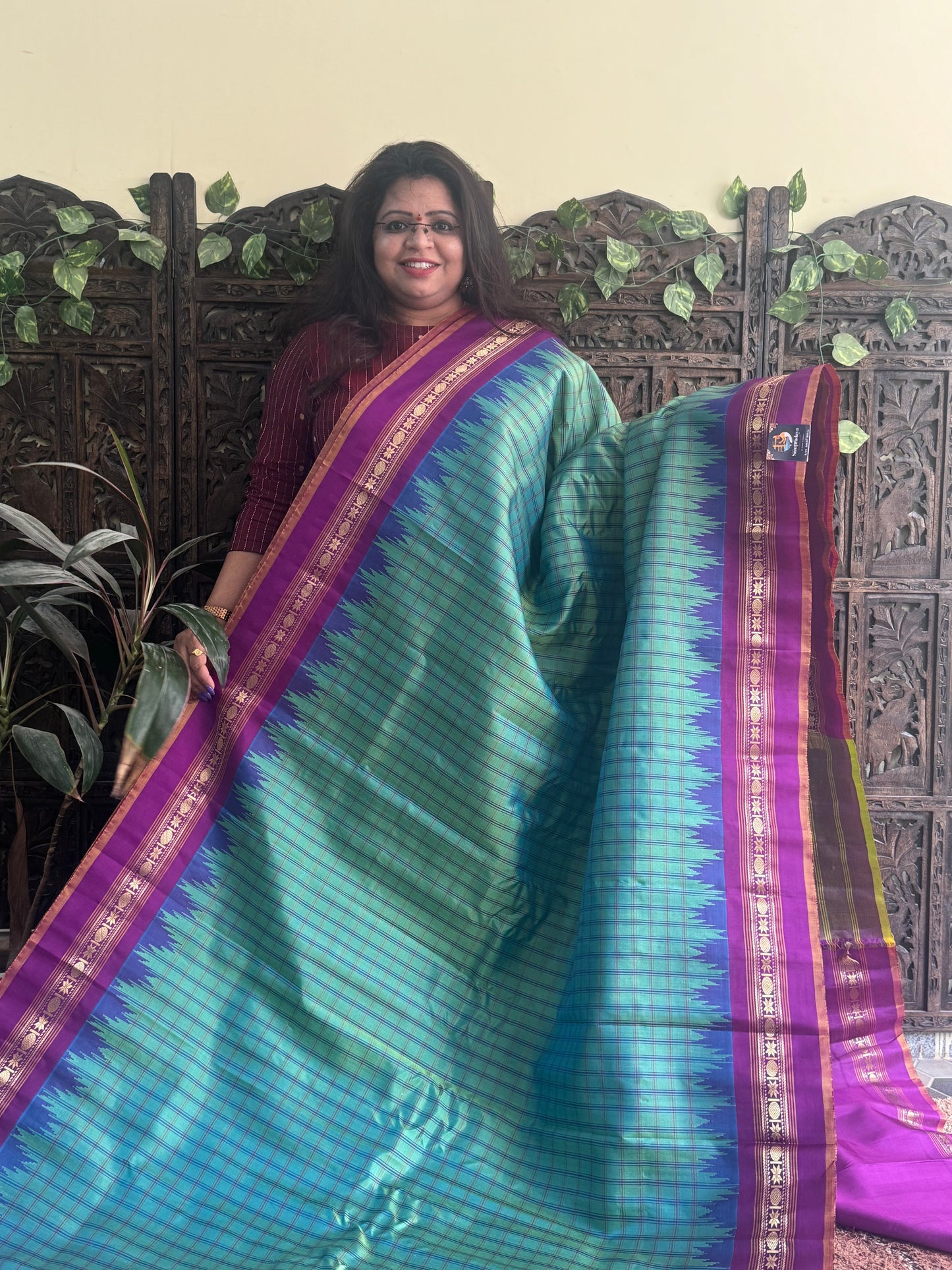 Gadwal Silk Saree Green Colored Complemented With a Purple Zari Border - Sampradaya Designer Studio