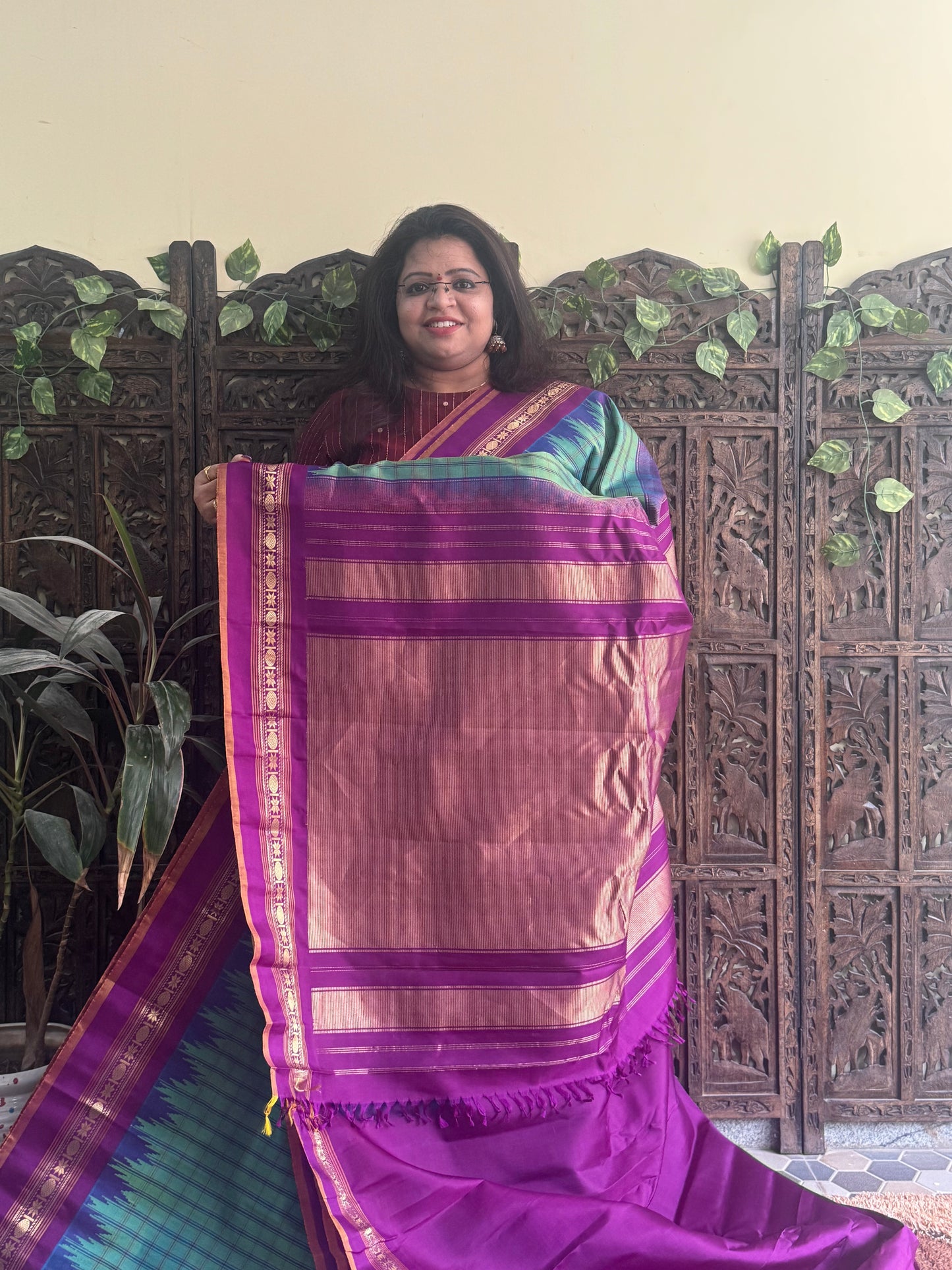 Gadwal Silk Saree Green Colored Complemented With a Purple Zari Border - Sampradaya Designer Studio