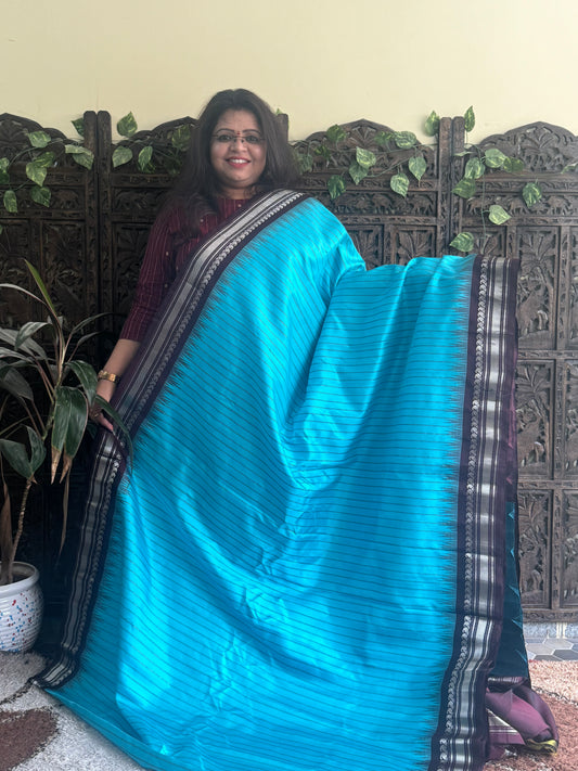 Gadwal Silk Saree Sky Blue Colored Complemented With a Brown Zari Border - Sampradaya Designer Studio