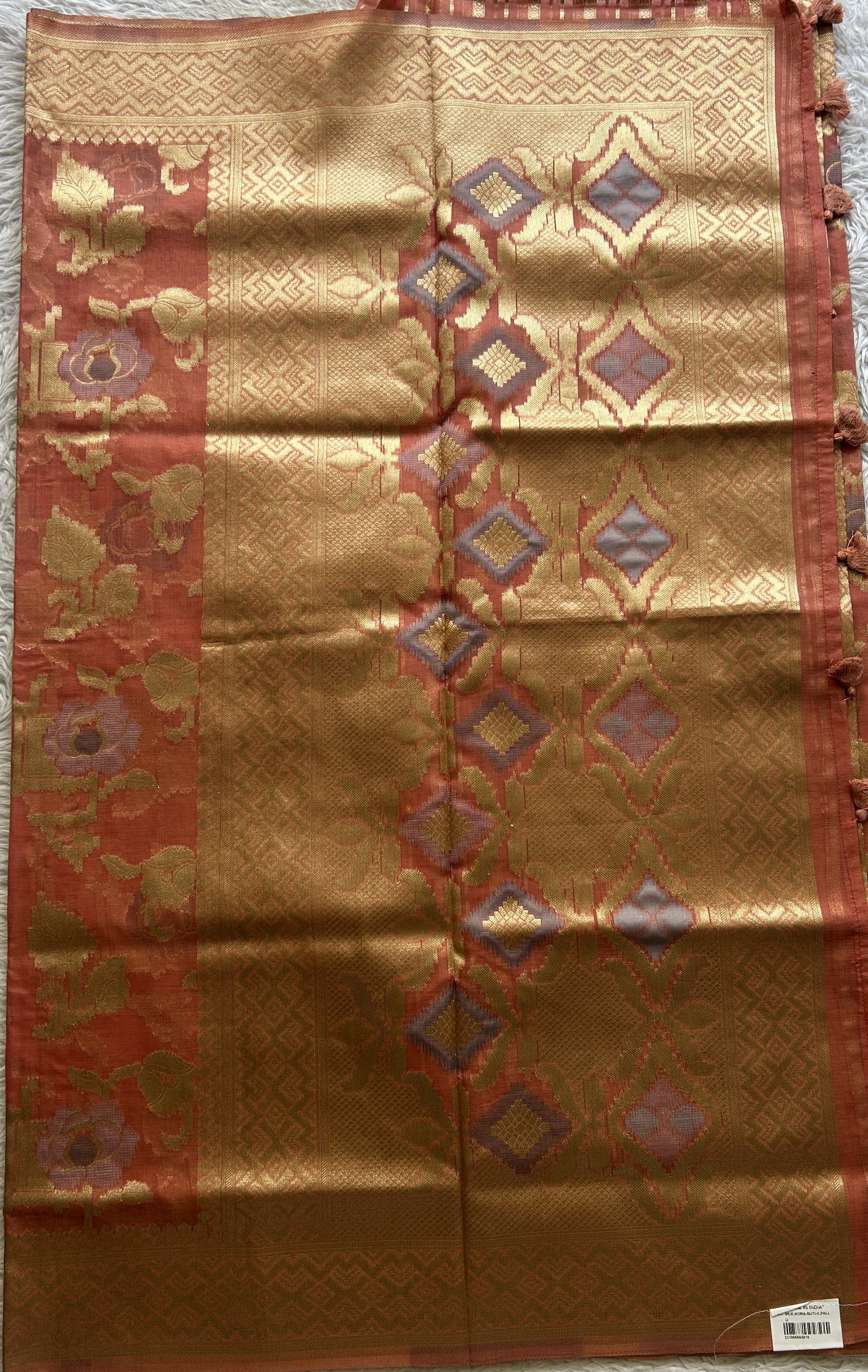 Semi Raw Silk Tissue Saree Dark Peach Colored Elegantly Paired with a Zari Border. - Sampradaya Designer Studio