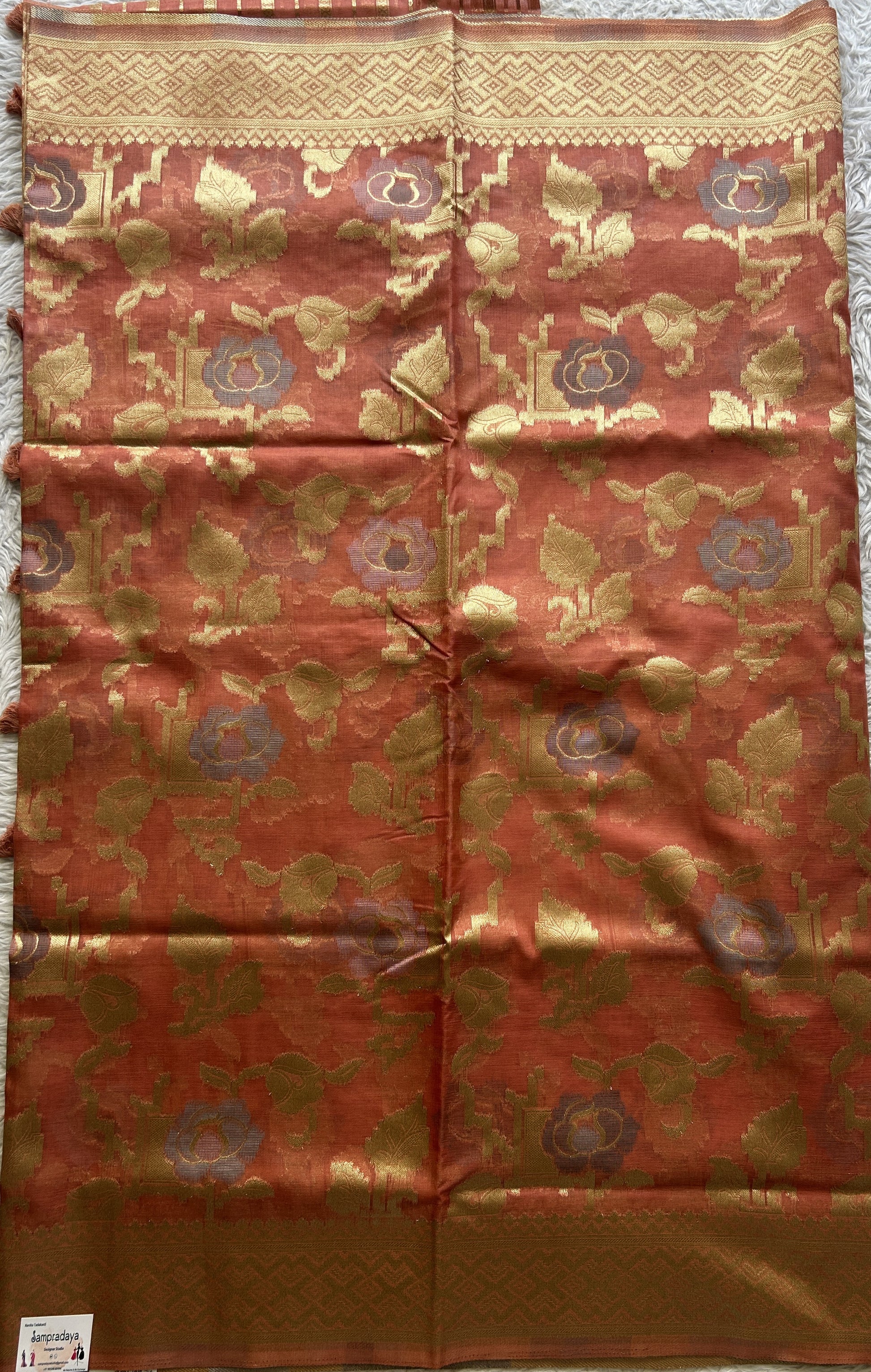 Semi Raw Silk Tissue Saree Dark Peach Colored Elegantly Paired with a Zari Border. - Sampradaya Designer Studio