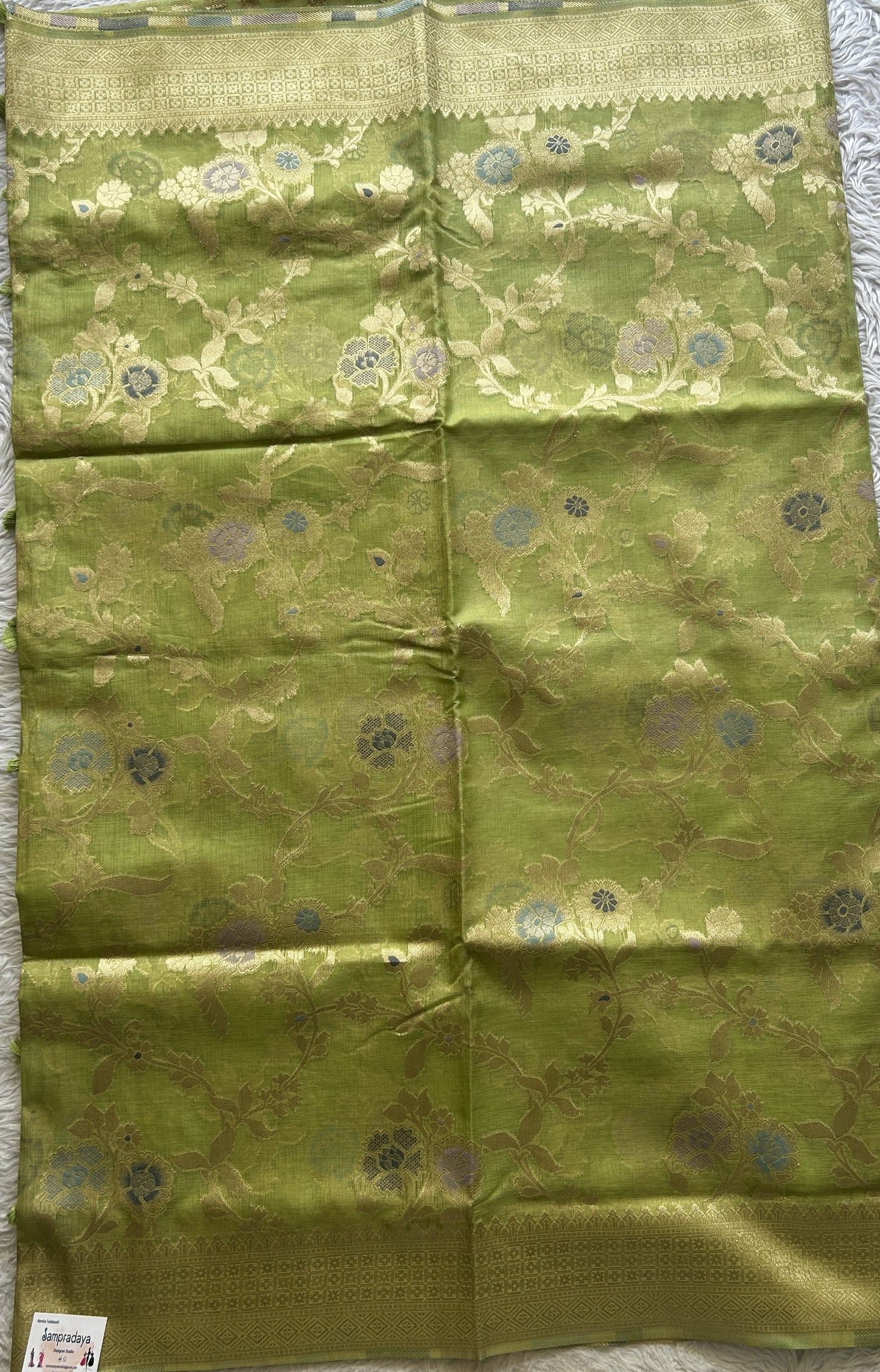 Semi Raw Silk Tissue Saree Light Green Colored Elegantly Paired with a Zari Border. - Sampradaya Designer Studio