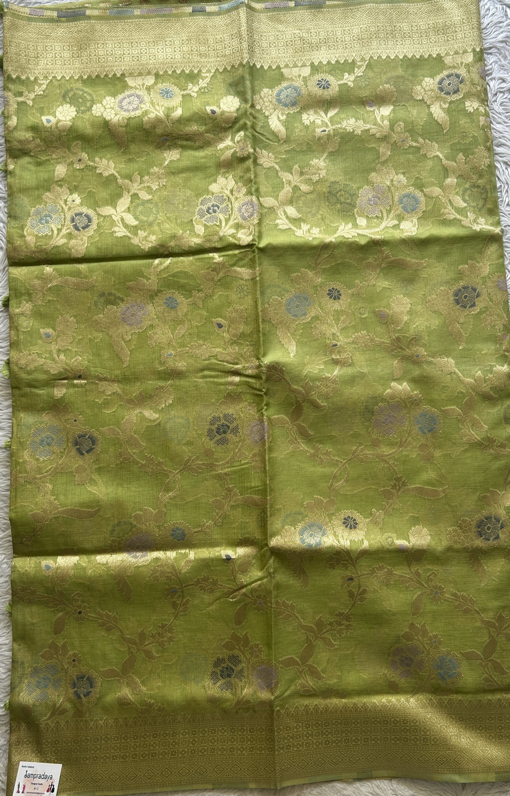 Semi Raw Silk Tissue Saree Light Green Colored Elegantly Paired with a Zari Border. - Sampradaya Designer Studio