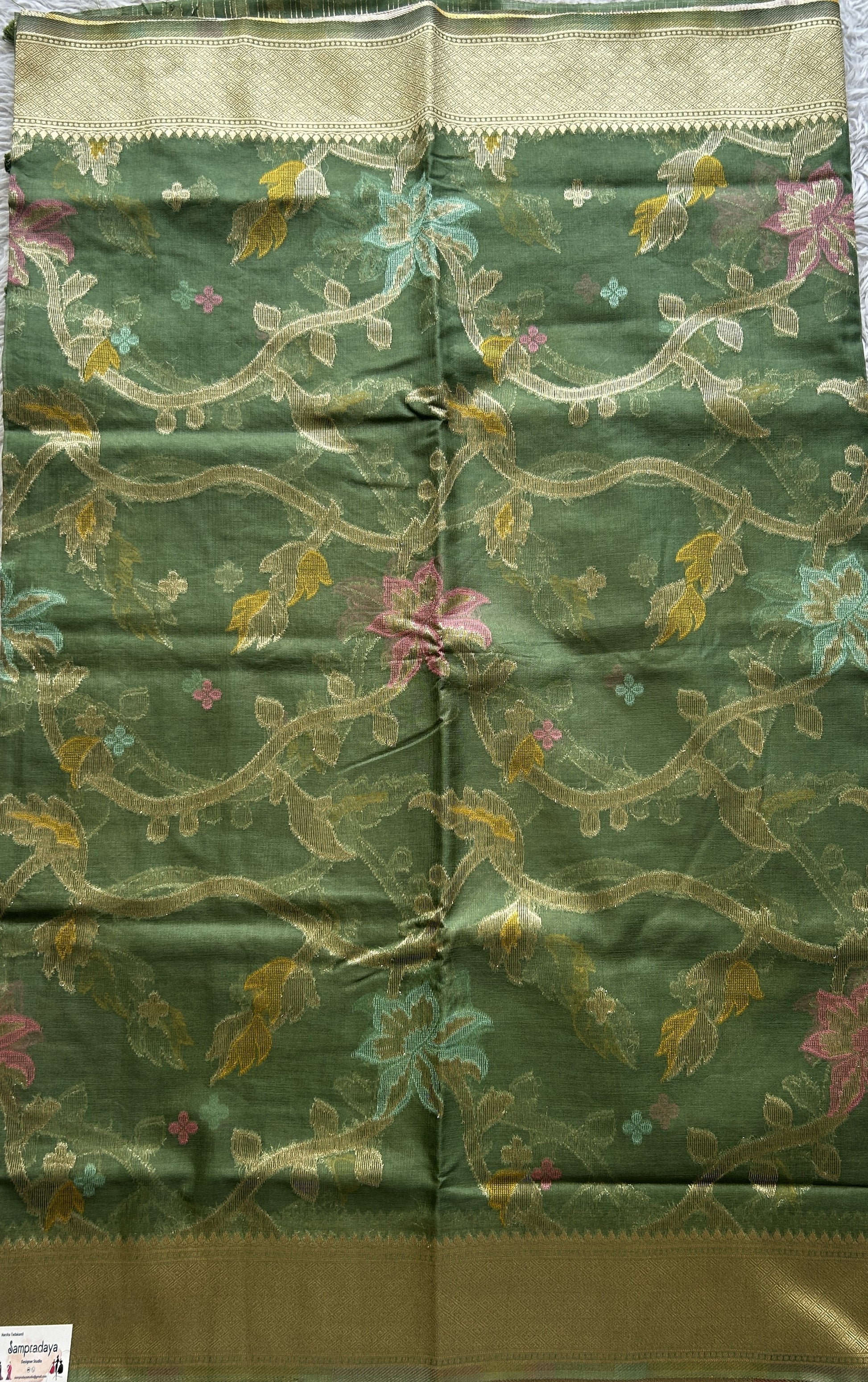 Semi Raw Silk Tissue Saree Olive Green Colored Elegantly Paired with a Zari Border. - Sampradaya Designer Studio