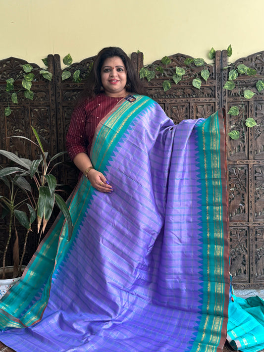 Gadwal Silk Saree Lilac Colored Complemented With a Sea Green Zari Border - Sampradaya Designer Studio