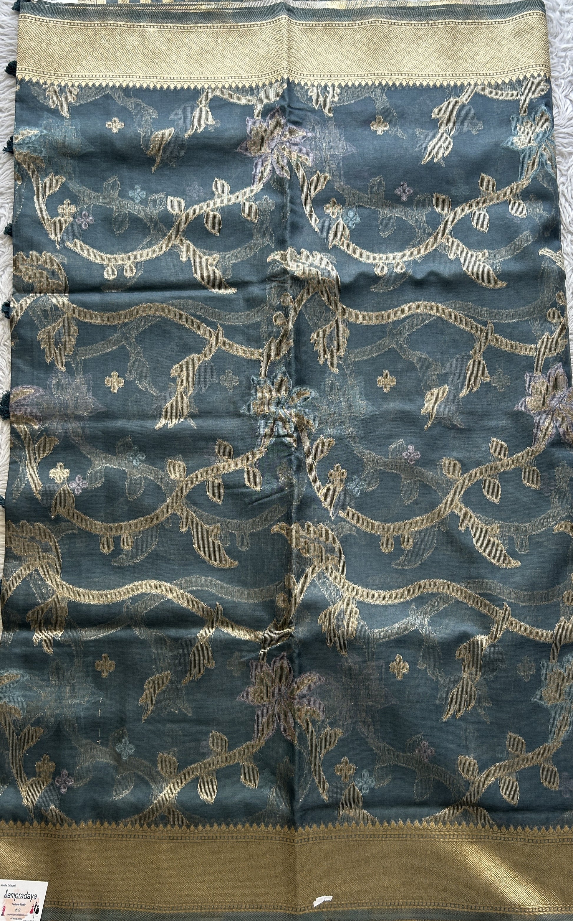 Semi Raw Silk Tissue Saree Grayish Blue Colored Elegantly Paired with a Zari Border. - Sampradaya Designer Studio