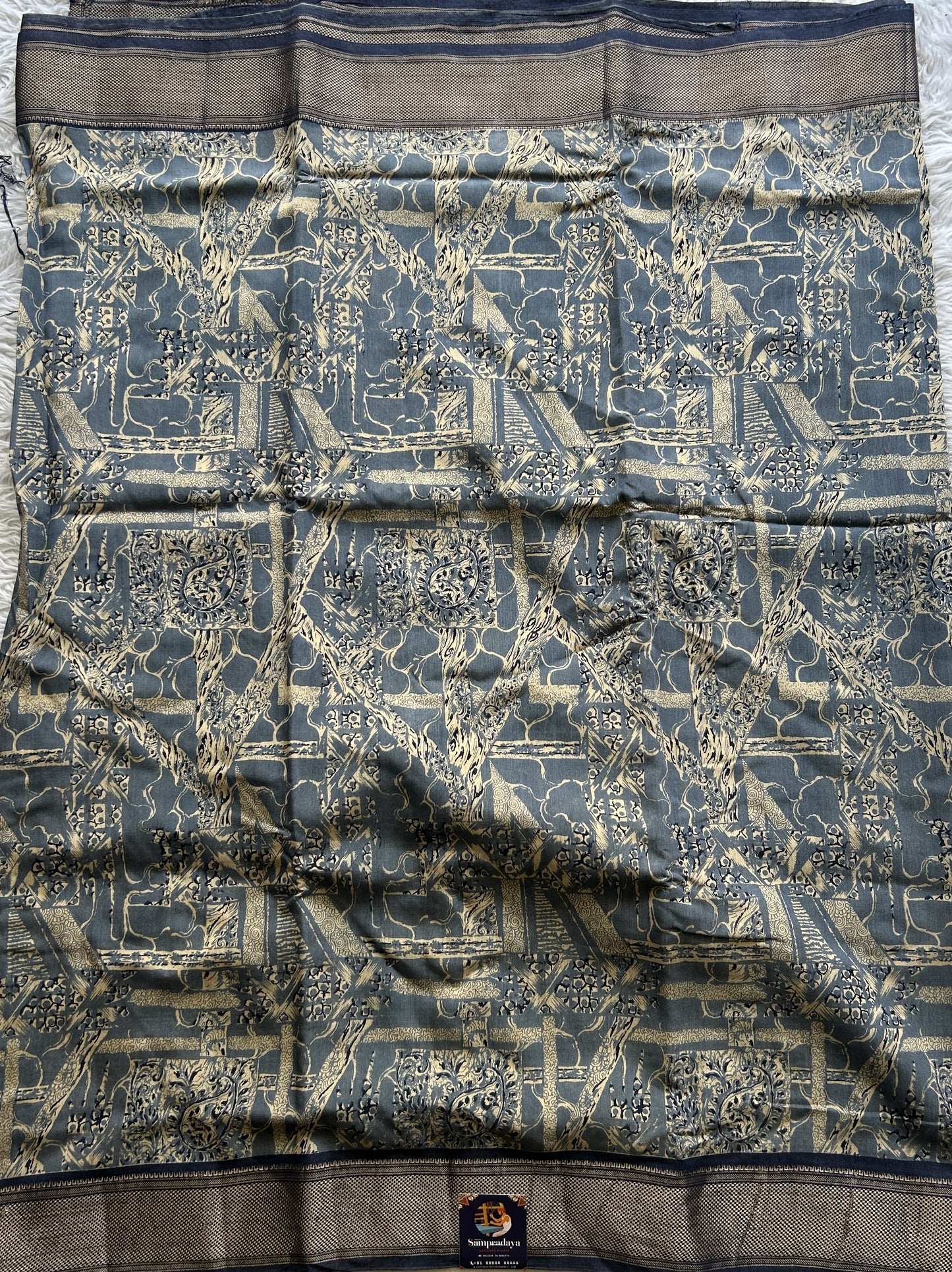 Dola Crepe Saree Indigo Blue Colored Elegantly Paired with a Zari Border. - Sampradaya Designer Studio