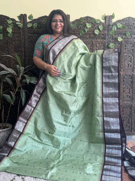 Gadwal Pattu Saree Green colored saree complemented with a Brown Zari border - Sampradaya Designer Studio
