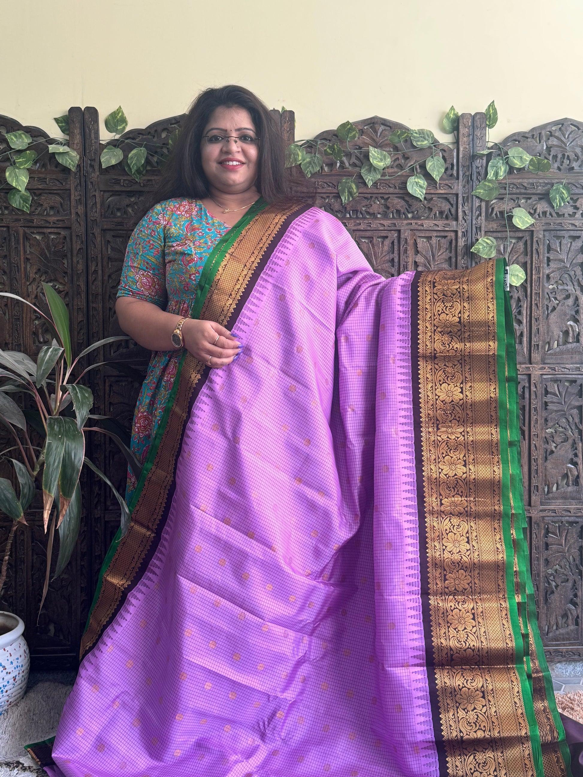 Gadwal Pattu Saree Lavender colored saree complemented with a Brown Zari border - Sampradaya Designer Studio