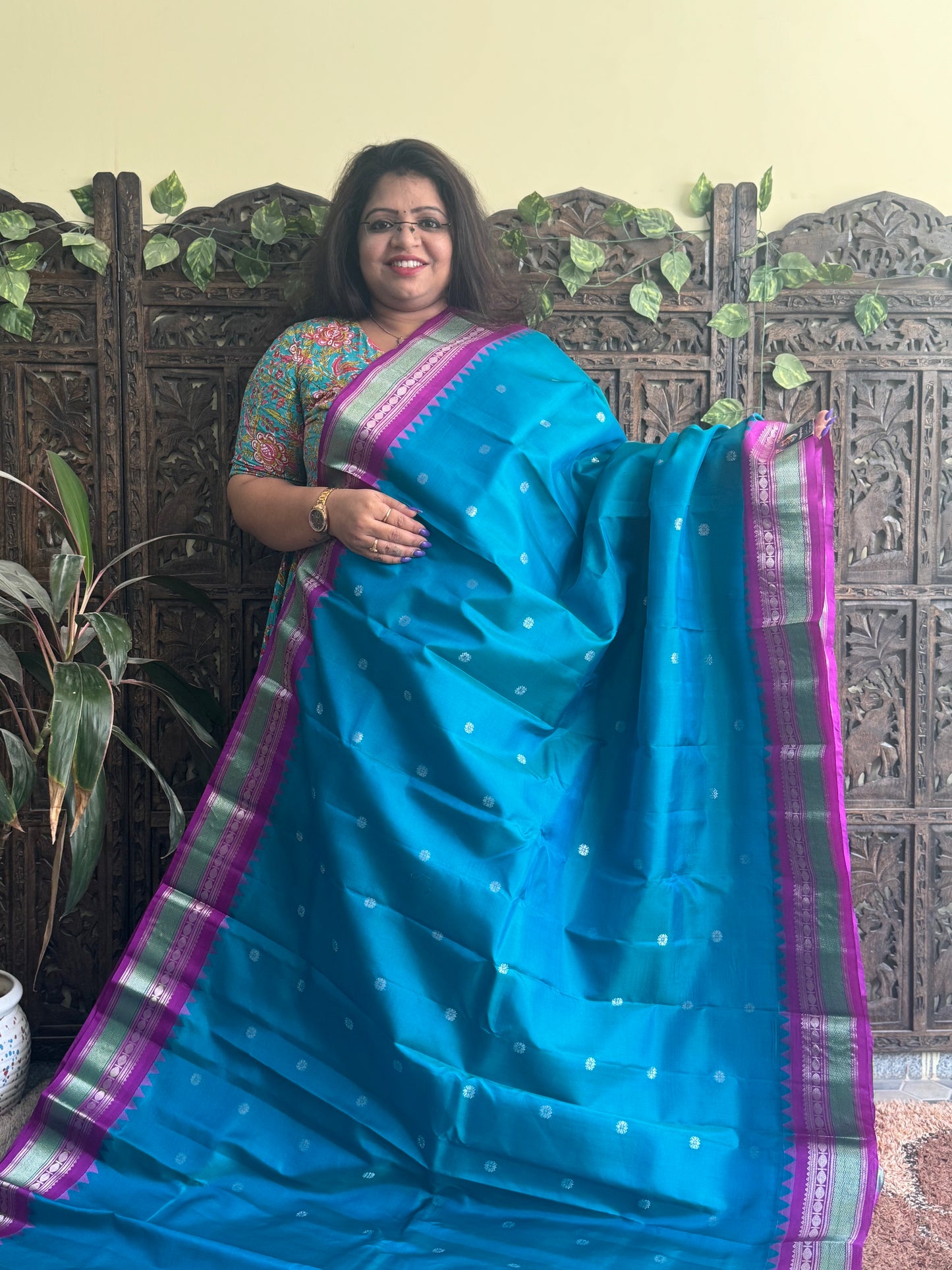Gadwal Pattu Saree Peacock Blue colored saree complemented with a Purple Zari border - Sampradaya Designer Studio