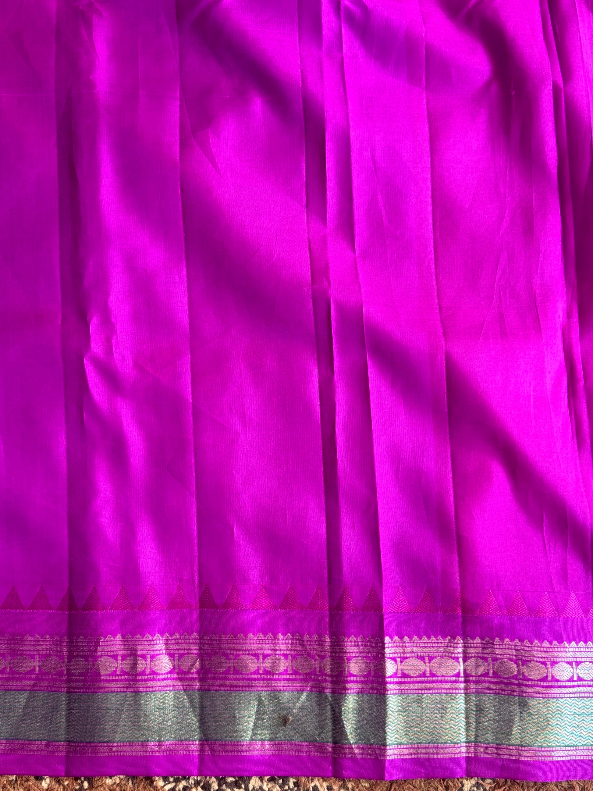 Gadwal Pattu Saree Peacock Blue colored saree complemented with a Purple Zari border - Sampradaya Designer Studio