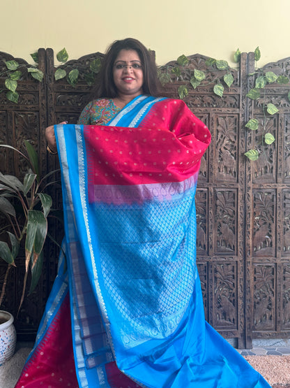 Gadwal Pattu Saree Red colored saree complemented with a Blue Zari border - Sampradaya Designer Studio