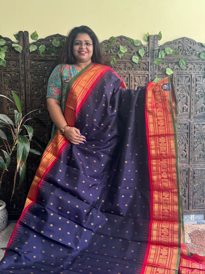 Gadwal Pattu Saree Dark Purple colored saree complemented with a Red Zari border - Sampradaya Designer Studio