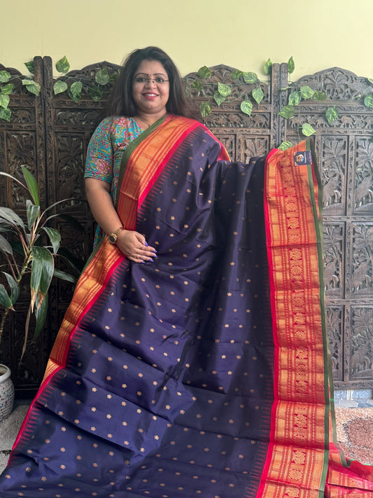 Gadwal Pattu Saree Dark Purple colored saree complemented with a Red Zari border - Sampradaya Designer Studio