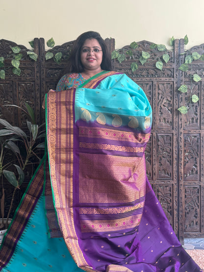 Gadwal Pattu Saree Sea Blue colored saree complemented with a Purple Zari border - Sampradaya Designer Studio