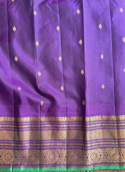 Gadwal Pattu Saree Sea Blue colored saree complemented with a Purple Zari border - Sampradaya Designer Studio