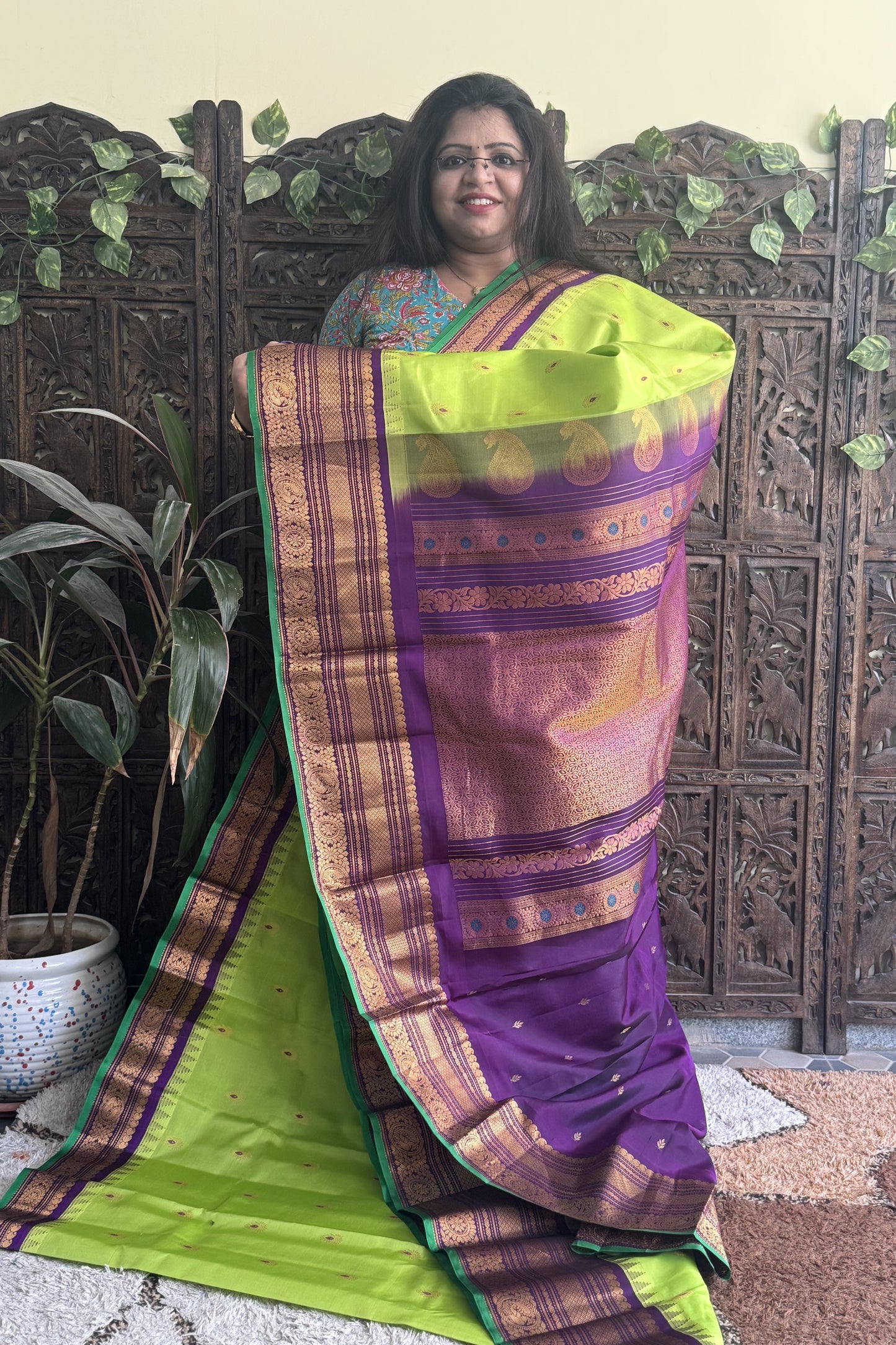 Gadwal Pattu Saree Parrot Green colored saree complemented with a Ink Blue Zari border - Sampradaya Designer Studio