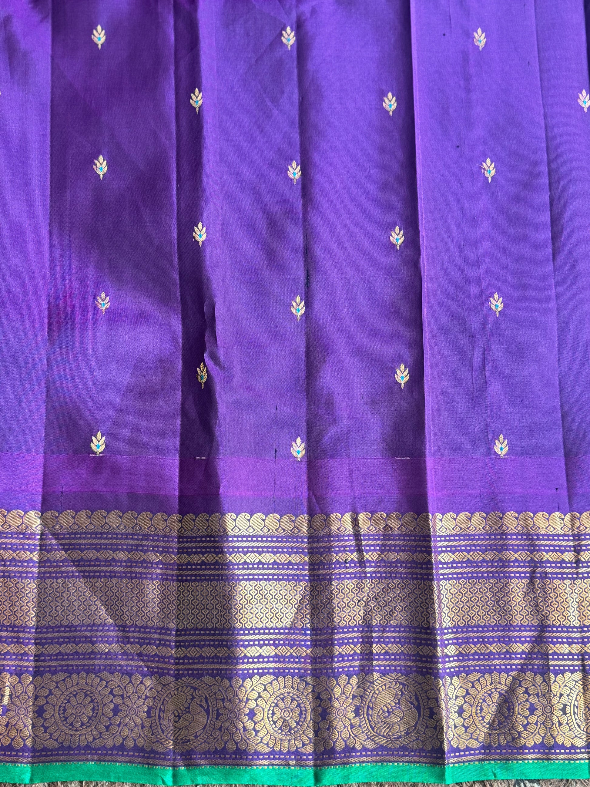 Gadwal Pattu Saree Parrot Green colored saree complemented with a Ink Blue Zari border - Sampradaya Designer Studio
