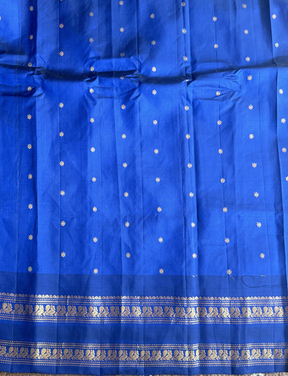 Gadwal Pattu Saree Dark Peach colored saree complemented with a Ink Blue Zari border - Sampradaya Designer Studio