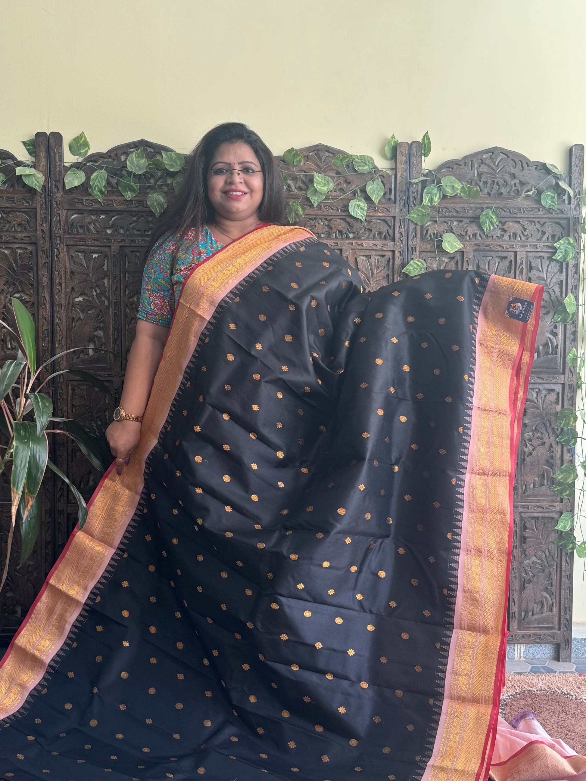 Gadwal Pattu Saree Black colored saree complemented with a Peach Zari border - Sampradaya Designer Studio