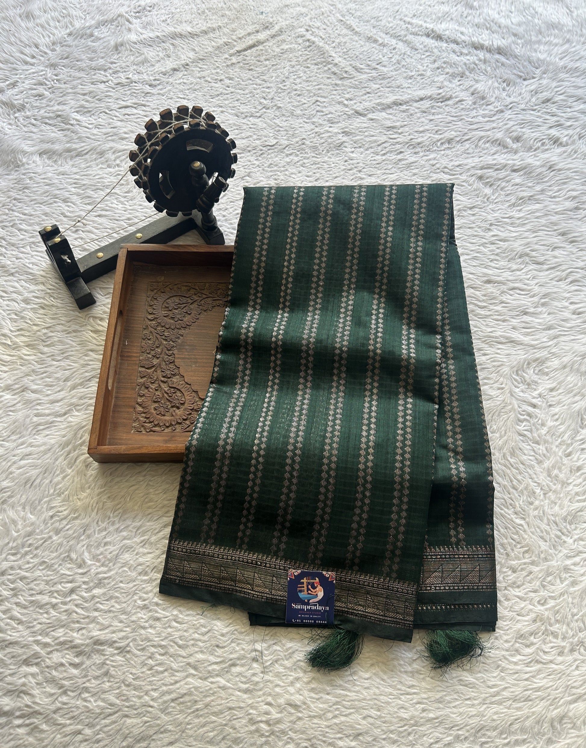 Semi Tussar Saree Colored Dark Green Complemented with a Zari Border. - Sampradaya Designer Studio