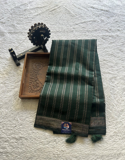 Semi Tussar Saree Colored Dark Green Complemented with a Zari Border. - Sampradaya Designer Studio