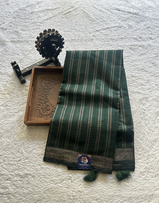 Semi Tussar Saree Colored Dark Green Complemented with a Zari Border. - Sampradaya Designer Studio