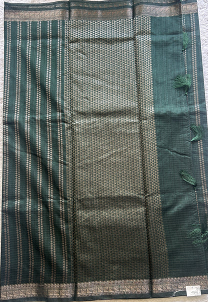 Semi Tussar Saree Colored Dark Green Complemented with a Zari Border. - Sampradaya Designer Studio