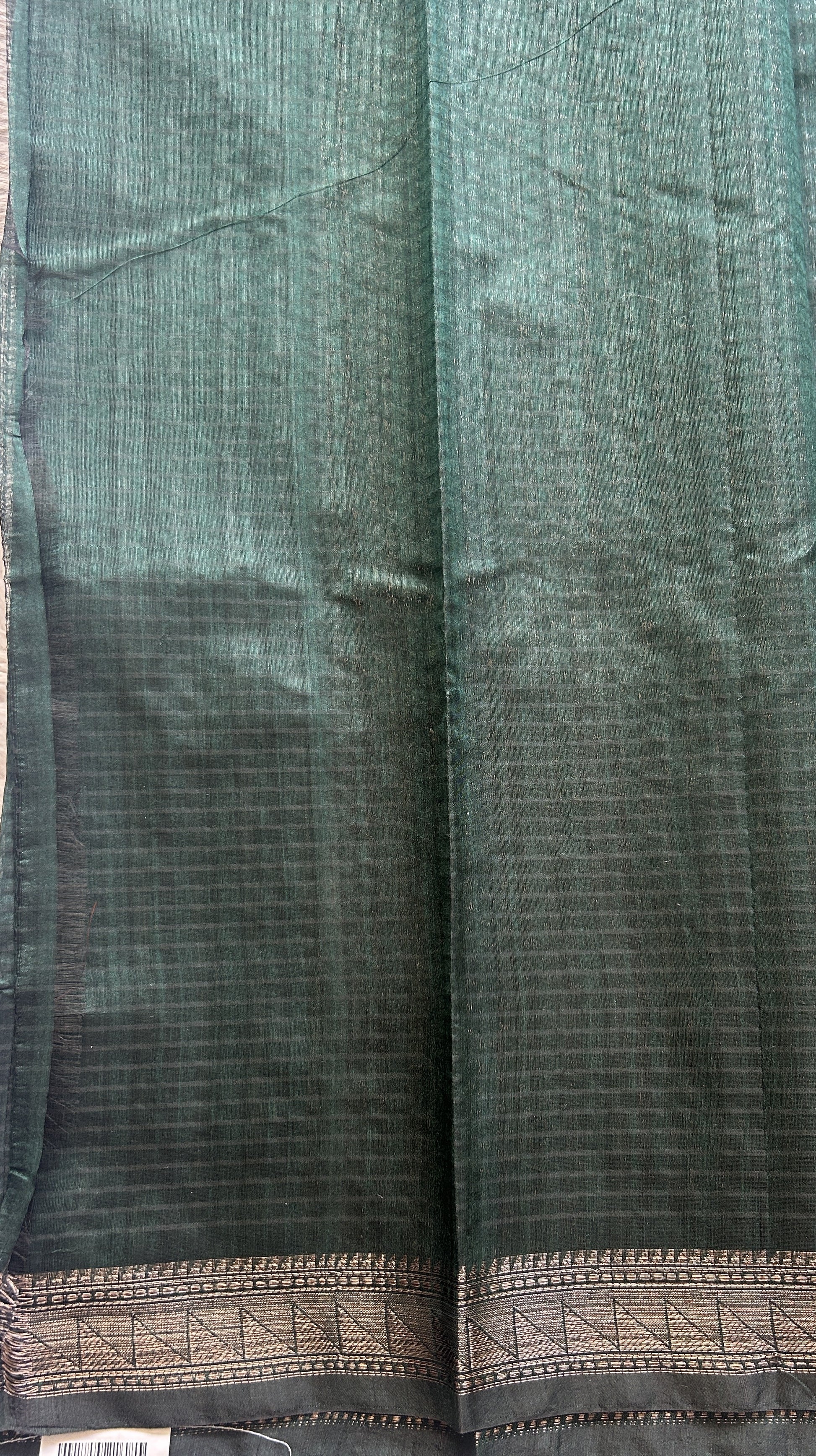 Semi Tussar Saree Colored Dark Green Complemented with a Zari Border. - Sampradaya Designer Studio