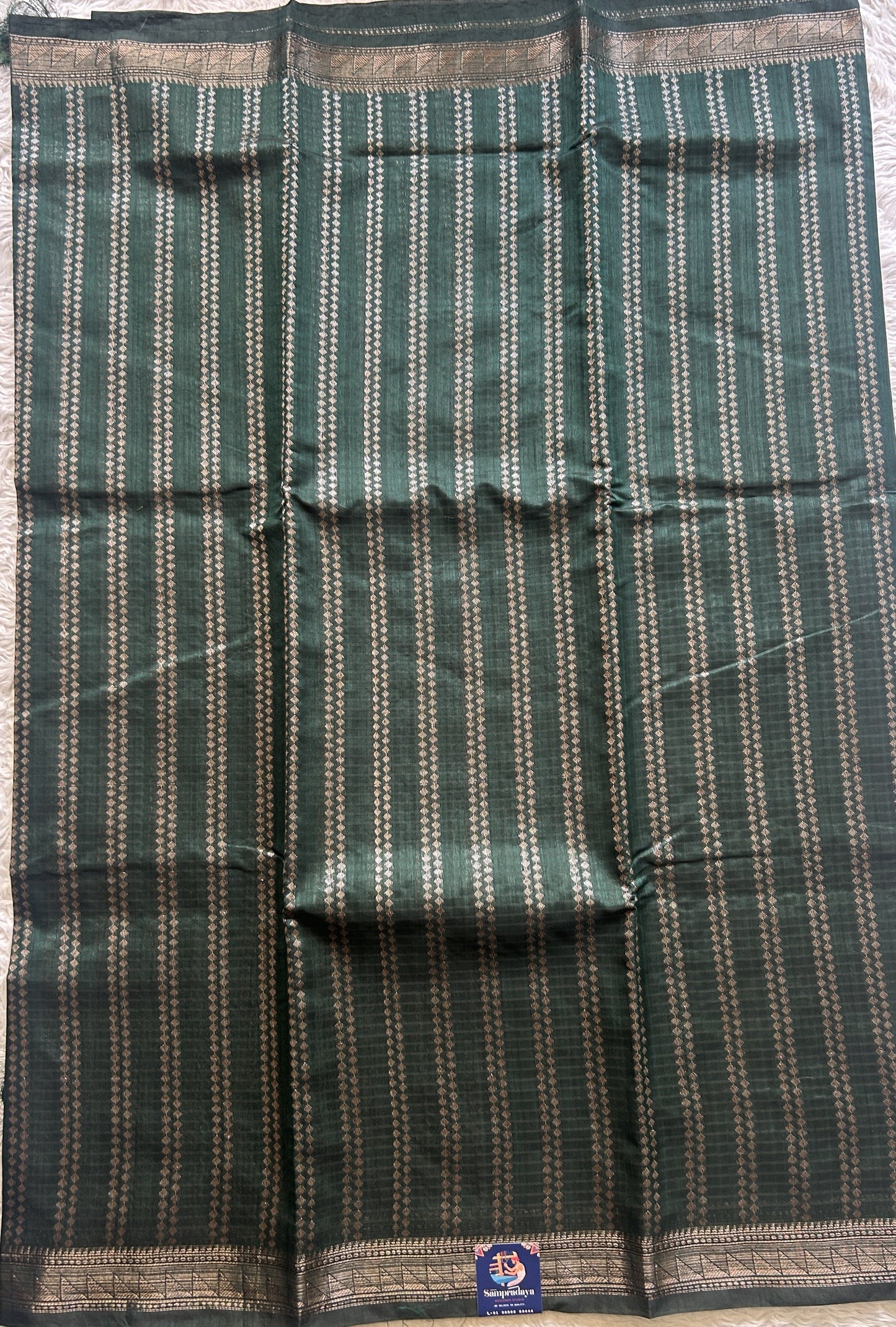 Semi Tussar Saree Colored Dark Green Complemented with a Zari Border. - Sampradaya Designer Studio