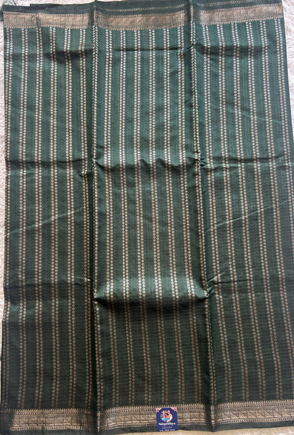 Semi Tussar Saree Colored Dark Green Complemented with a Zari Border. - Sampradaya Designer Studio