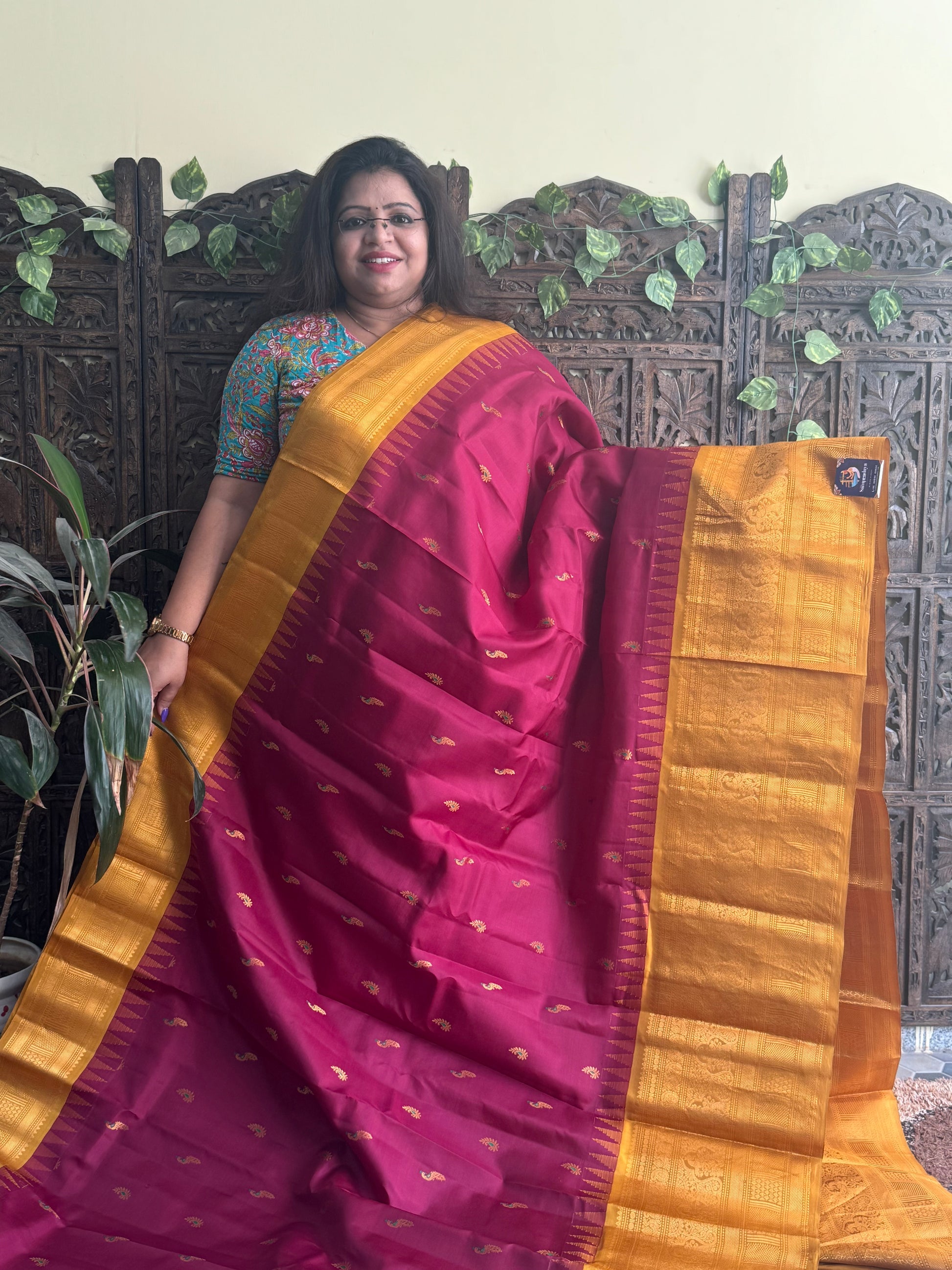 Gadwal Pattu Saree Maroon colored saree complemented with a Mustard Zari border - Sampradaya Designer Studio