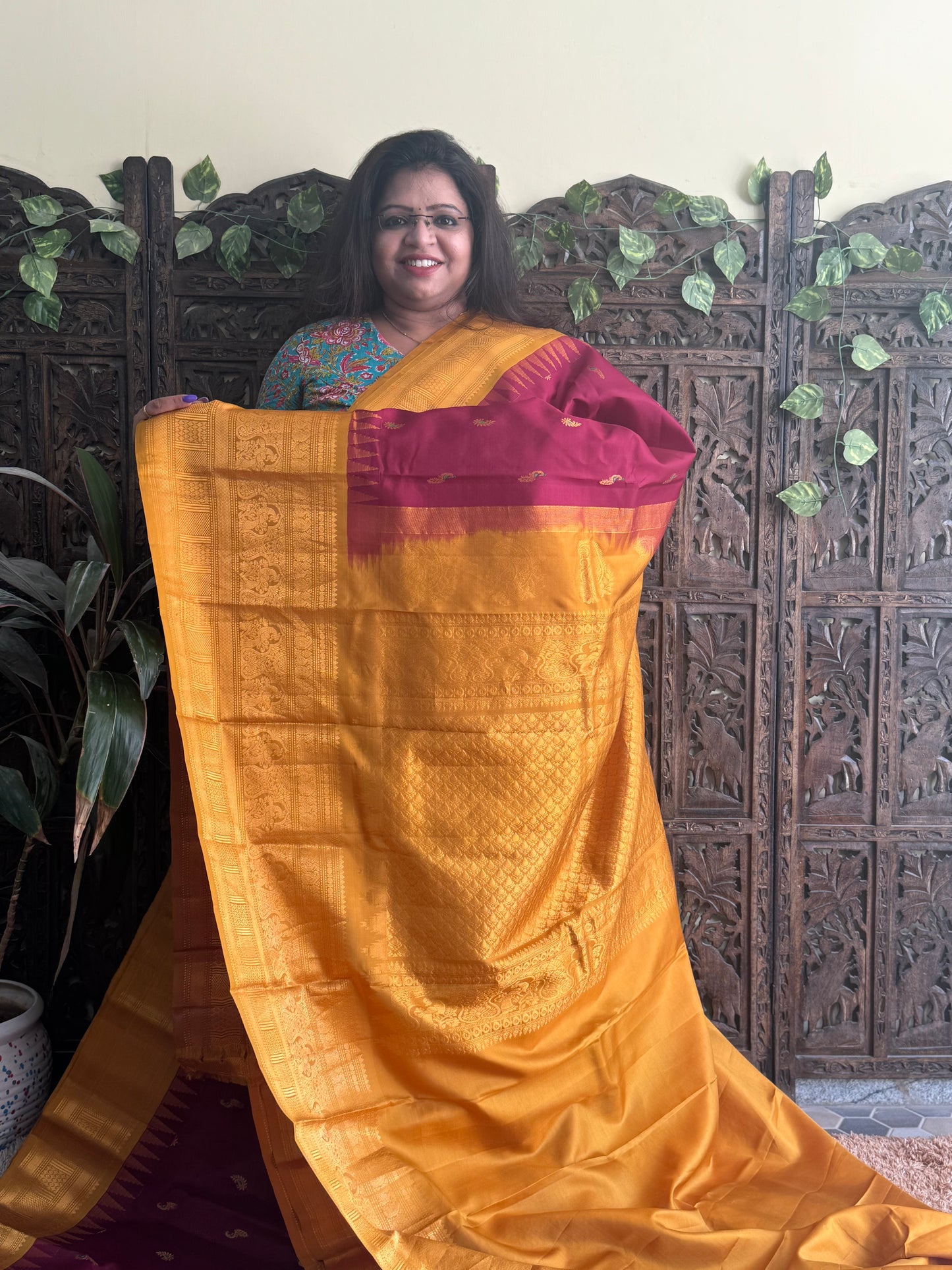 Gadwal Pattu Saree Maroon colored saree complemented with a Mustard Zari border - Sampradaya Designer Studio