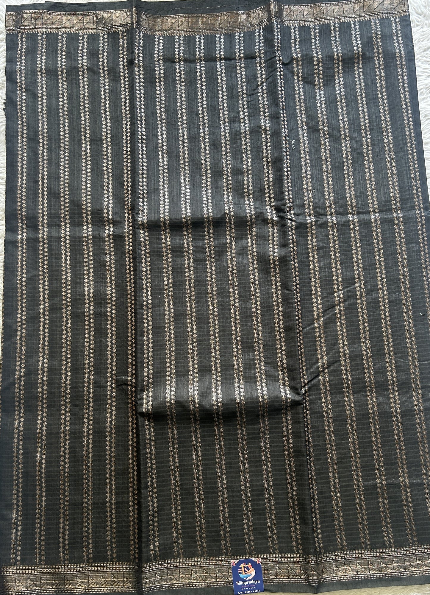 Semi Tussar Saree Colored Black Complemented with a Zari Border. - Sampradaya Designer Studio