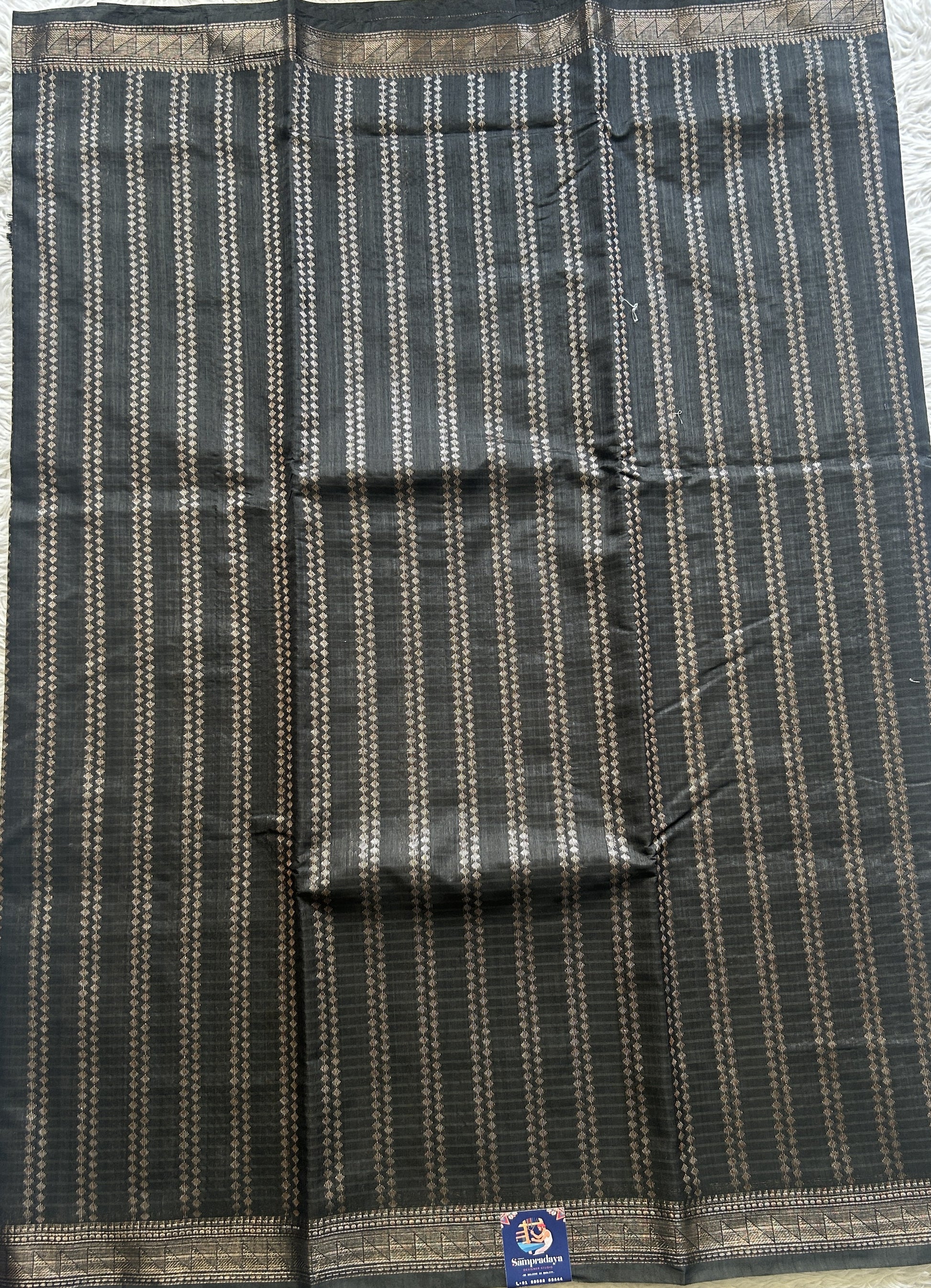 Semi Tussar Saree Colored Black Complemented with a Zari Border. - Sampradaya Designer Studio