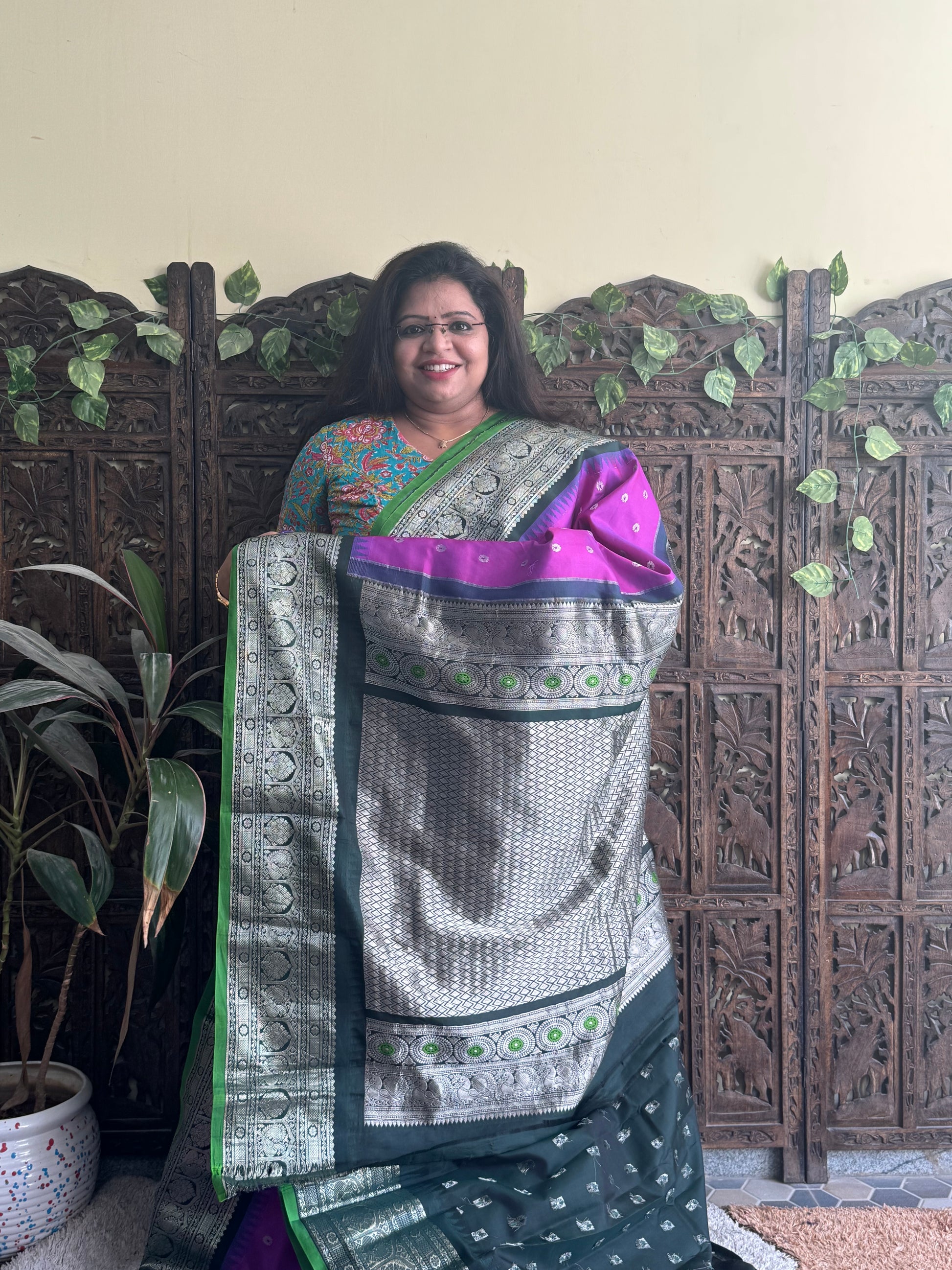Gadwal Pattu Saree Purple colored saree complemented with a Black Zari border - Sampradaya Designer Studio